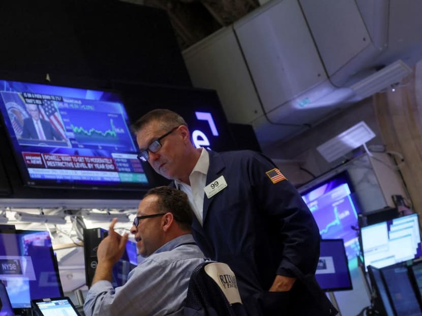 Traders react on the floor of the New York Stock Exchange (NYSE) as a screen shows Federal Reserve Board Chairman Jerome Powell during a news conference following a Fed rate announcement, in New York City on July 27, 2022. Traders react on the floor of the New York Stock Exchange (NYSE) as a screen shows Federal Reserve Board Chairman Jerome Powell during a news conference following a Fed rate announcement, in New York City on July 27, 2022.