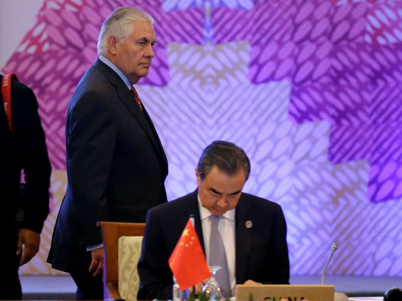 US Secretary of State Rex Tillerson (left) and Chinese Foreign Minister Wang Yi at the 7th East Asia Summit Foreign Ministers’ Meeting. Mr Tillerson and others blasted China’s military build-up in the South China Sea. Photo: Reuters