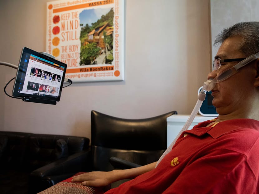 Mr Ooi Lin Kah, who suffers from amyotrophic lateral sclerosis, using his eye gaze-enabled tablet at home. Mr Ooi Lin Kah, who suffers from amyotrophic lateral sclerosis, using his eye gaze-enabled tablet at home.