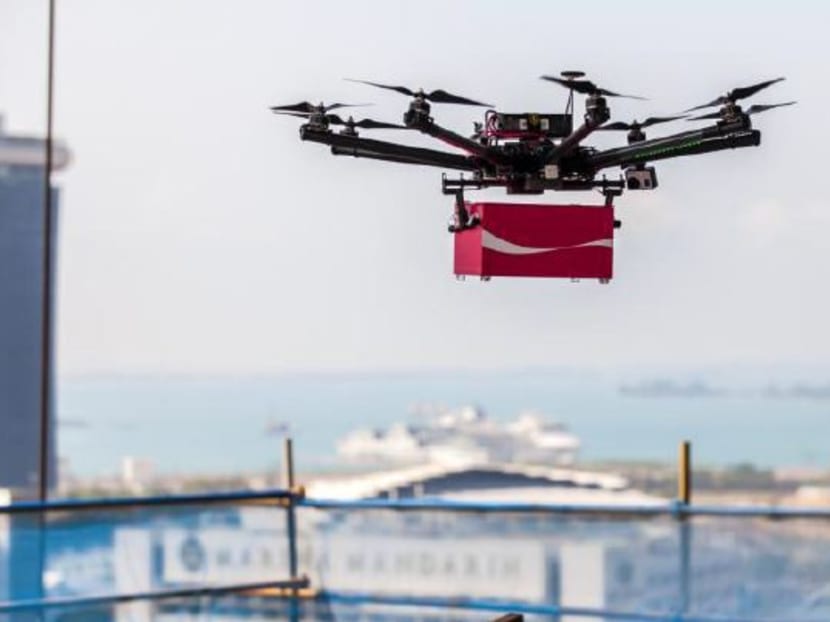 Flying drones deliver gifts to foreign workers
