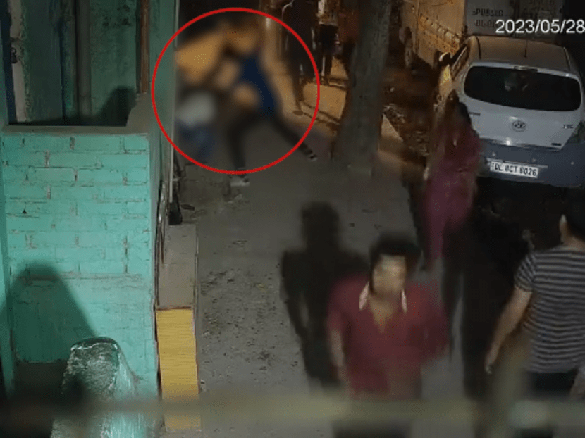 CCTV footage shows the accused stabbing the victim repeatedly on a street in full view of people walking by.