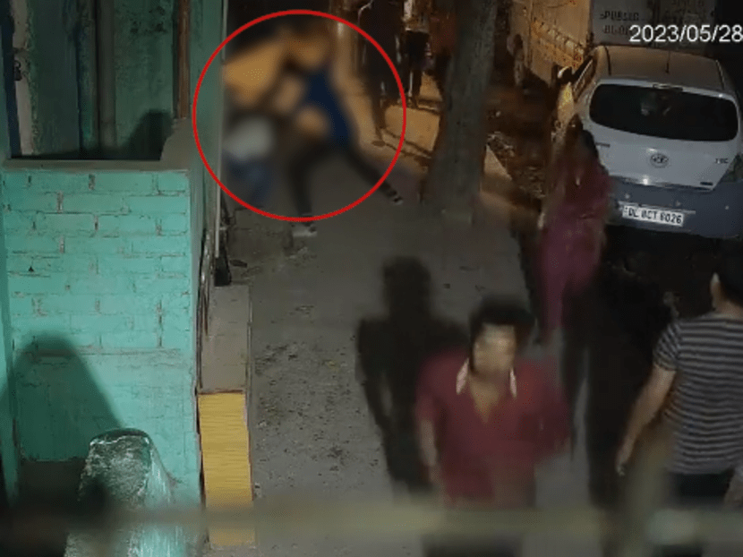 CCTV footage shows the accused stabbing the victim repeatedly on a street in full view of people walking by. CCTV footage shows the accused stabbing the victim repeatedly on a street in full view of people walking by.