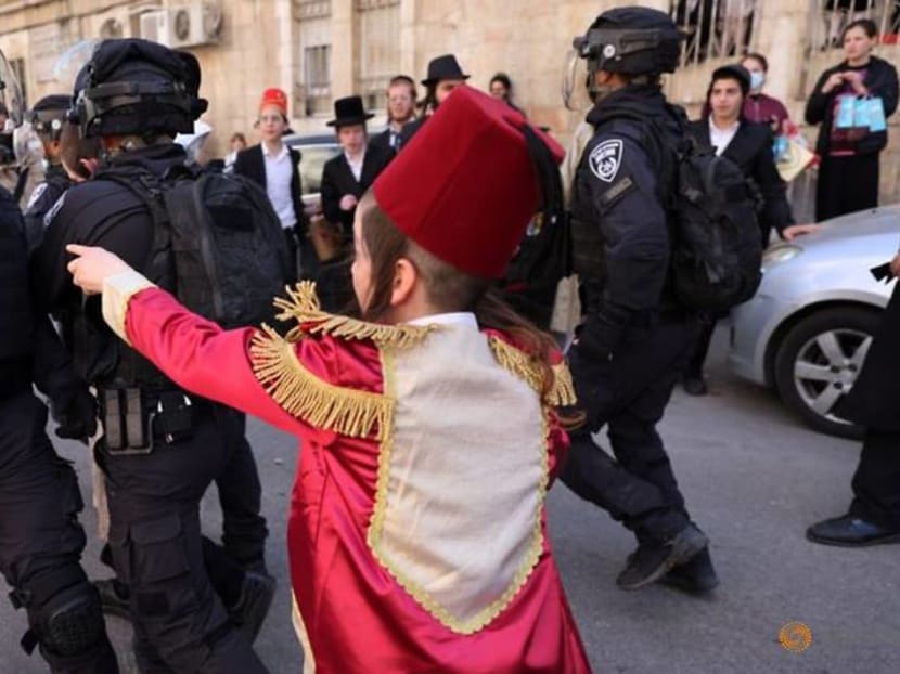 COVID curbs dampen carousing on Jewish costume festival Purim COVID curbs dampen carousing on Jewish costume festival Purim