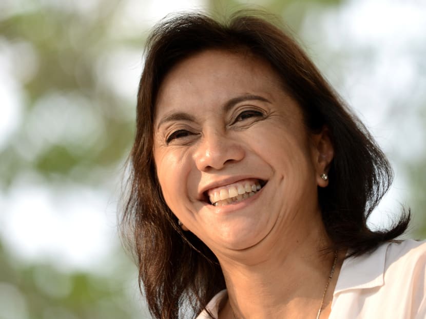 This file photo taken on May 15, 2016 shows Philippines vice presidential candidate and activist lawyer-turned congresswoman Leni Robredo smiling after attending a mass in Manila. Photo: AFP