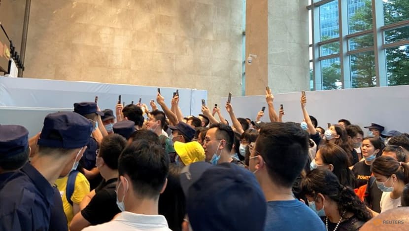Disgruntled China Evergrande investors crowd headquarters in protest Disgruntled China Evergrande investors crowd headquarters in protest