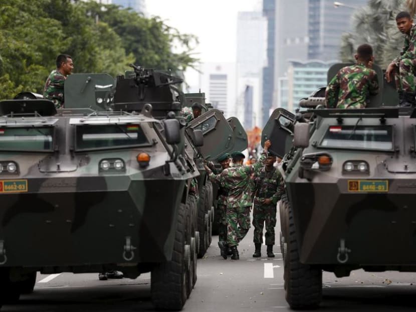 Military armoured personnel carriers are seen near the site of an attack in central Jakarta in 2016.