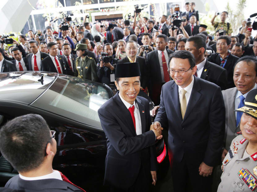 Religious hardliners have staged rallies against Mr Basuki (right, with 
Mr Widodo) becoming Governor, contending that as a Christian and ethnic Chinese, he should not be allowed to govern the capital city of a Muslim-majority country.
Photo: REUTERS