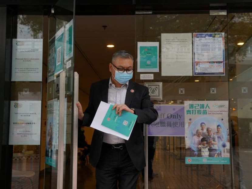 A man wearing a face mask leaves a vaccination centre administering Covid-19 vaccine, in Hong Kong on March 23, 2021. A man wearing a face mask leaves a vaccination centre administering Covid-19 vaccine, in Hong Kong on March 23, 2021.