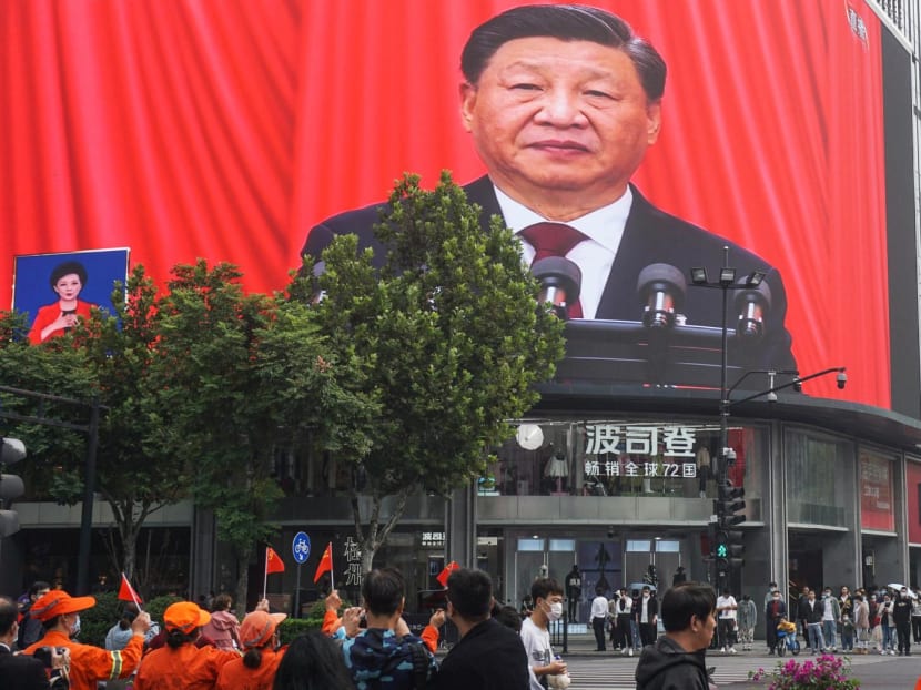 People watch an outdoor screen showing the live speech of Chinese President Xi Jinping during the opening session of the 20th Chinese Communist Party Congress in Hangzhou, China, on Oct 16, 2022. People watch an outdoor screen showing the live speech of Chinese President Xi Jinping during the opening session of the 20th Chinese Communist Party Congress in Hangzhou, China, on Oct 16, 2022.
