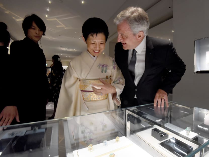 President and chief executive officer of Christian Dior Couture, Sidney Toledano, guiding Japan's Princess Takamado (right) during a preview of Dior's new shop at the Ginza shopping district in Tokyo on April 19, 2017.