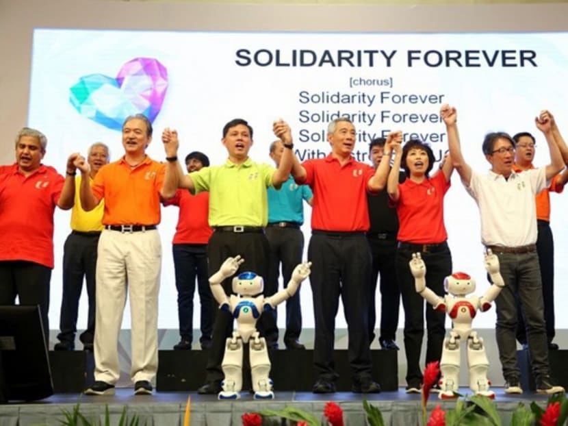 PM Lee Hsien Loong with NTUC President Mary Liew (right) and Secretary General Chan Chun Sing (left) with other union representatives singing "Solidarity Together" during the May Day Rally at Our Tampines Hub. Photo: Nuria Ling/TODAY