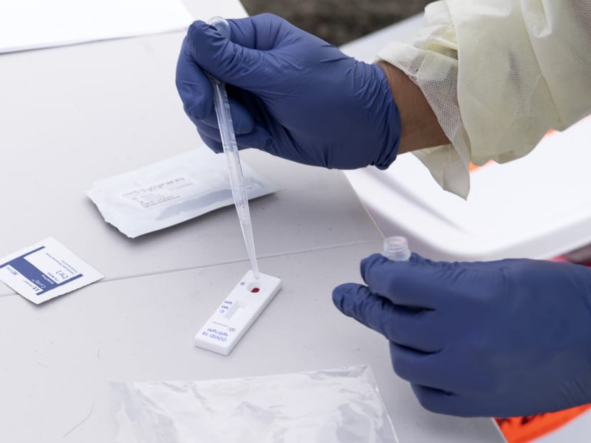 A health worker processes a patient's blood for Covid-19 antibodies at the the Diagnostic and Wellness Centre in Torrance, California on May 5, 2020.