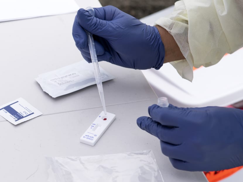 A health worker processes a patient's blood for Covid-19 antibodies at the the Diagnostic and Wellness Centre in Torrance, California on May 5, 2020. A health worker processes a patient's blood for Covid-19 antibodies at the the Diagnostic and Wellness Centre in Torrance, California on May 5, 2020.