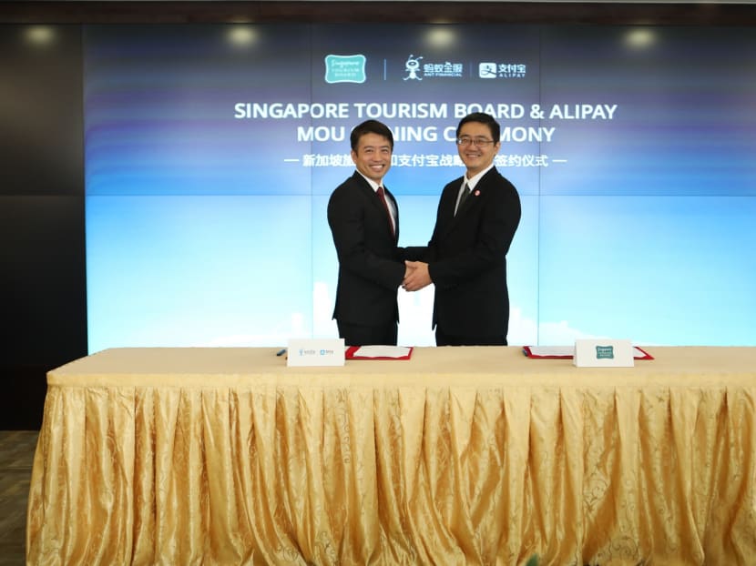Alipay Global’s marketing and operations head Tony Tai (left) and STB chief technology officer Quek Choon Yang at the MOU signing yesterday. Both organisations will share data on trends in Chinese travel to Singapore with tourism industry stakeholders here, among other initiatives. Photo: Alipay