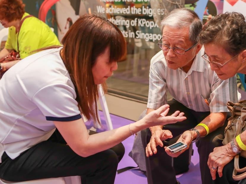 GET UP 2018 visitors learning how to use a job-search app. Photos: North East Community Development Council GET UP 2018 visitors learning how to use a job-search app. Photos: North East Community Development Council