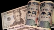 Yen clings to sharp gains after suspected intervention, Fed in focus