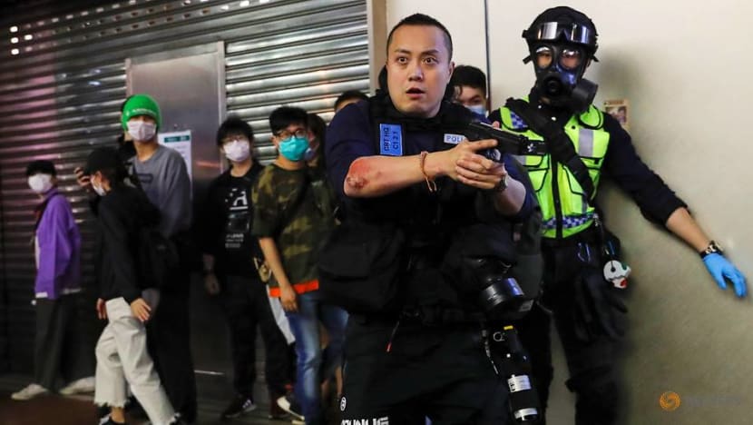 Hong Kong police fire tear gas as black-clad protesters return to streets Hong Kong police fire tear gas as black-clad protesters return to streets
