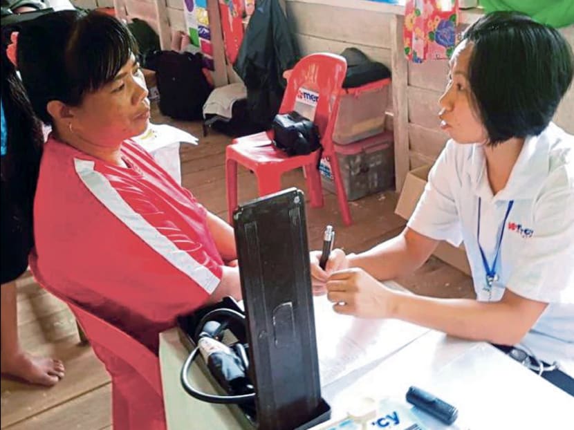 Volunteers from non-governmental organisation Mercy and conglomerate UMW Malaysia offering medical services to villagers in Kampung Lirung, a remote village in Sabah. Photo: New Straits Times