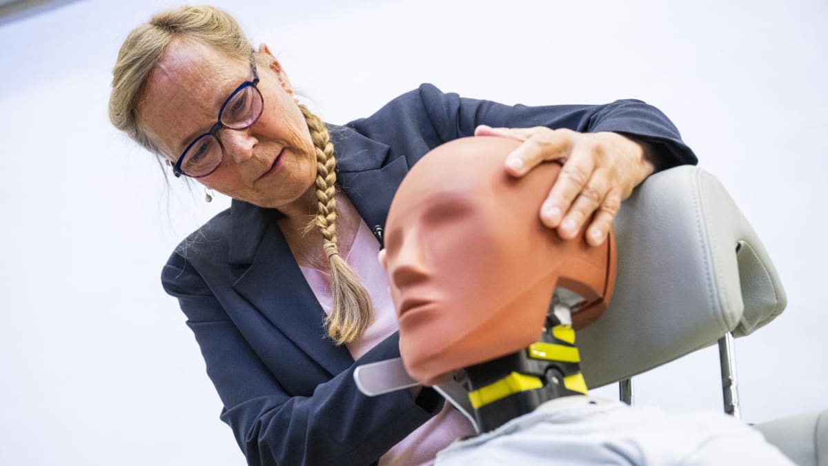 Women in the driver's seat with female crash test dummy