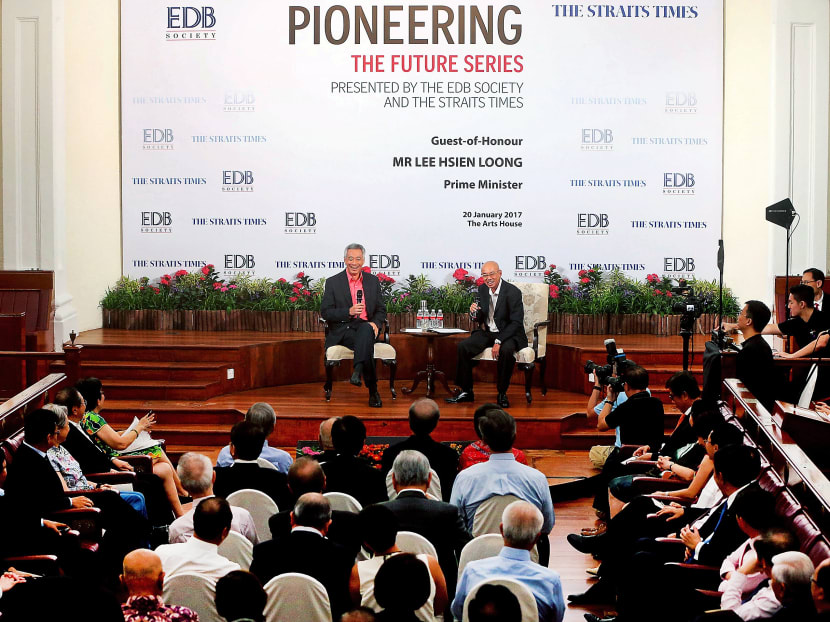 PM Lee and ST editor-at-large Han Fook Kwang at the dialogue organised by the Economic Development Board Society and The Straits Times. Mr Lee reiterated that Singapore could do well if it can achieve 2 to 3 per cent growth annually for the next decade. Photo: Ooi Boon Keong