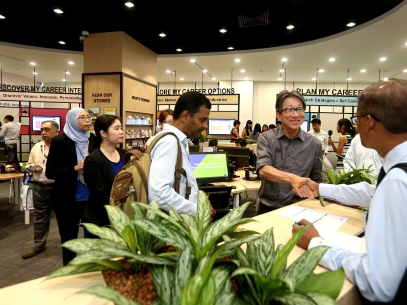 Manpower Minister Lim Swee Say speaking with jobseekers during the official opening of Careers Connect at the Lifelong Learning Institute on July 19, 2017. Photo: Nuria Ling/TODAY