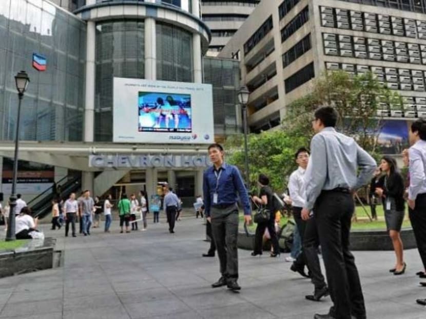 Office workers out to lunch in Singapore's financial district. Photo: Channel Newsasia