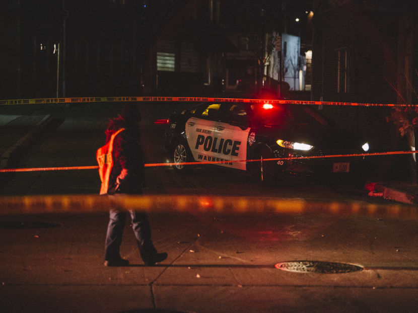 Police cordon off the scene in Waukesha, Wisconsin where an SUV drove through pedestrians at a holiday parade, killing at least one and injuring 20 more