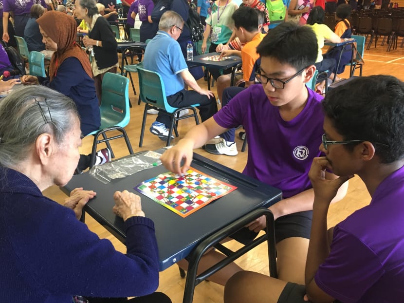 Seniors from St Luke's Eldercare Centre playing games with Secondary 3 students from Fajar Secondary School, at the school's annual Inter-Generational Games on October 26, 2017. Photo: Louisa Tang/TODAY