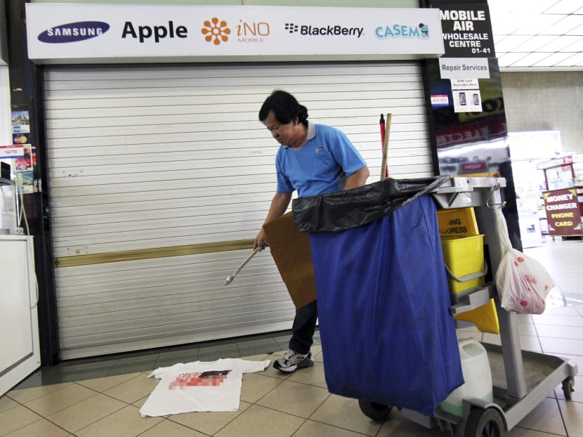A T-shirt with an expletive was found outside the offending shop, Mobile Air, at Sim Lim Square. Today File Photo