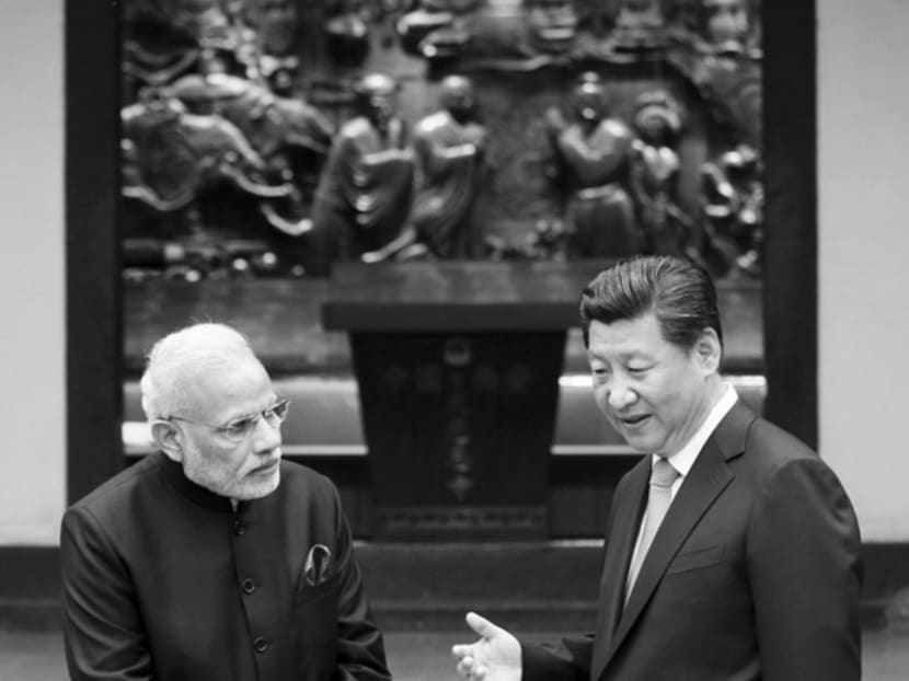 Chinese President Xi Jinping (left) and Indian Premier Narendra Modi at a temple in Shaanxi province, China last month. Both Mr Xi and Mr Modi are political strongmen who profess mutual respect, but their politics are poles apart. Photo: Reuters