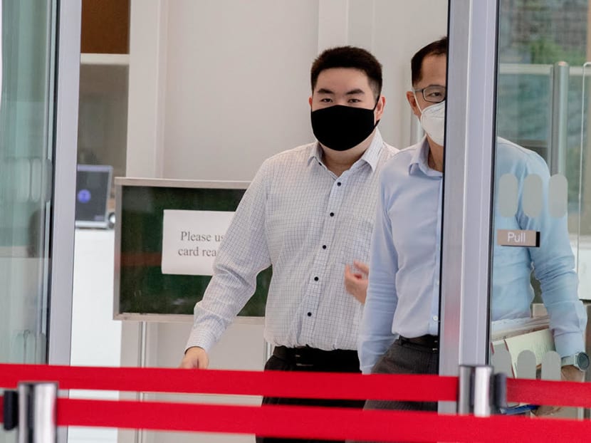 Colin Chua Yi Jin (left) leaving the State Courts in July 2021.