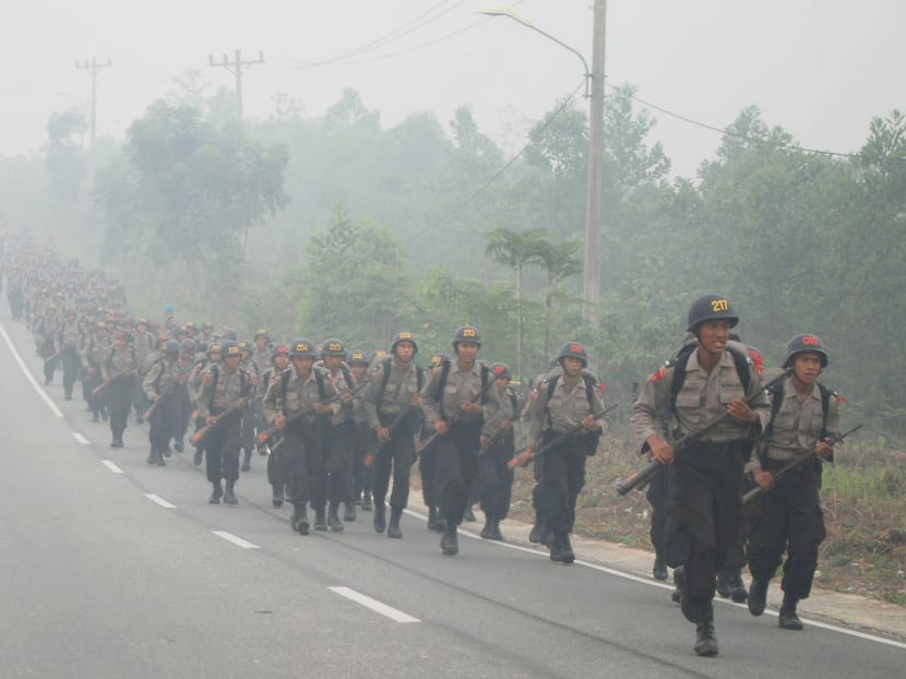 Students of Indonesia’s State Police School exercising in Pekanbaru, Riau province, on Sept 30, 2015. Indonesia has deployed more resources to contain the haze, which has affected the region in recent weeks. Photo: Reuters