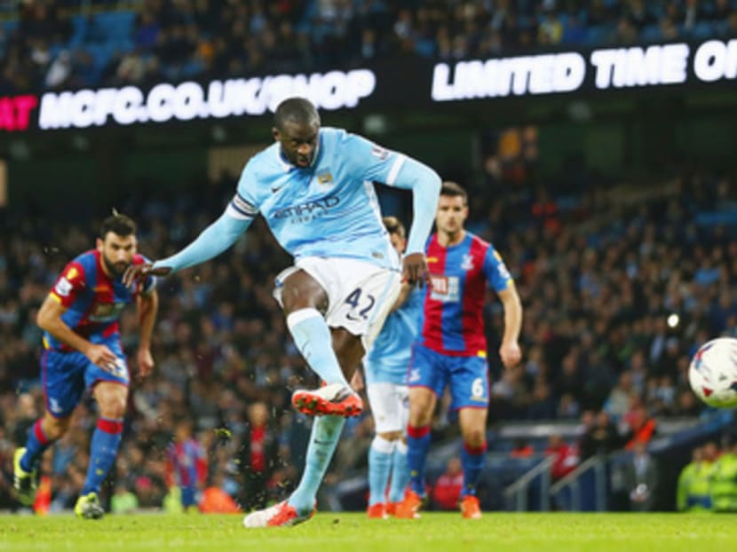 Toure (in blue) has netted decisive goals for City and will be remembered as an important player in the club’s history when he leaves. Photo: Getty Images