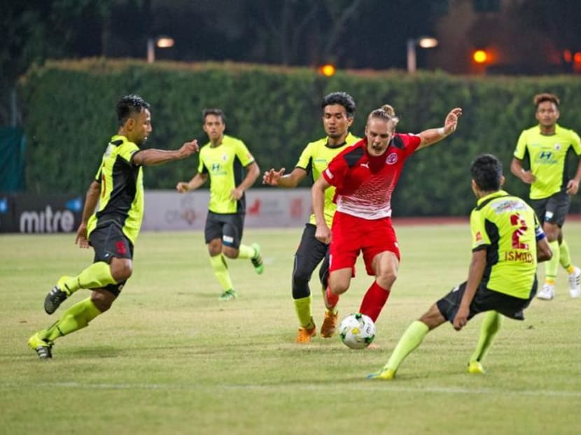 Danish striker Ken Ilso (in red) in action for Home United in the S.League last season. He joined Malaysian side Kedah this year and said the Malaysian players are better than their Singapore counterparts. Photo: S.League