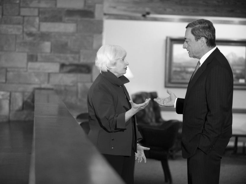 Fed chair Janet Yellen with Mr Draghi at the Jackson Hole symposium last month. Mr Draghi has said the inflation outlook may soon justify QE like that by the Fed. Photo: Bloomberg