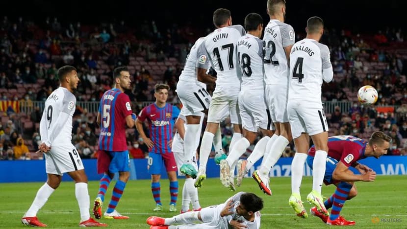 Football: Barca scrape late draw with Granada as fans stay away Football: Barca scrape late draw with Granada as fans stay away