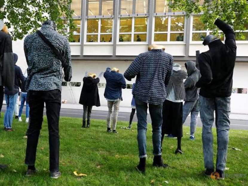 Syrian artist's Silent Demonstration watches over German war crimes trial Syrian artist's Silent Demonstration watches over German war crimes trial