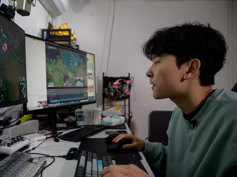 South Korean gamer Kim Min-kyo streams computer games at his home near Anyang, south of Seoul on Feb 8, 2021. Livestreamers, known as "Broadcast Jockeys" or BJs in South Korea, are hard-wired to the digital infrastructure of youth culture.