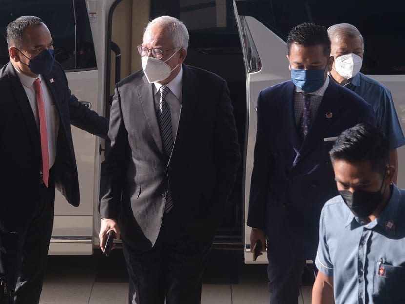 Najib Razak (centre) arriving at the Kuala Lumpur High Court on Oct 26, 2021. Najib Razak (centre) arriving at the Kuala Lumpur High Court on Oct 26, 2021.