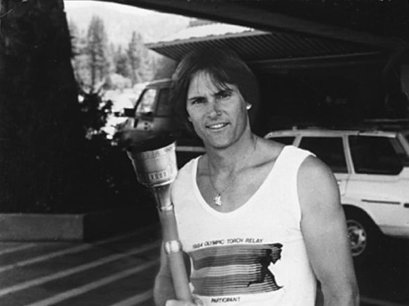 American Decathlete Bruce Jenner poses with the 1984 Olympic Torch he carried through Lake Tahoe, Nevada in 1984. Photo: Heritage Auctions via AP
