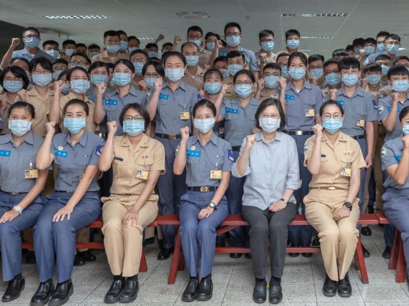 Taiwan's president Tsai Ing-wen poses with Taiwan Navy soldiers during her visit to a naval base in Suao, Yilan, Taiwan in this handout picture released on Aug 18, 2022. 