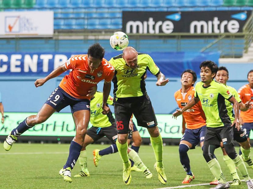 Tampines Rovers striker Billy Mehmet (in yellow) challenging for a header with his Albirex Niigata opponent at the teams' S.League match at Jalan Besar Stadium on Wednesday, October 26, 2016. Photo: S.League