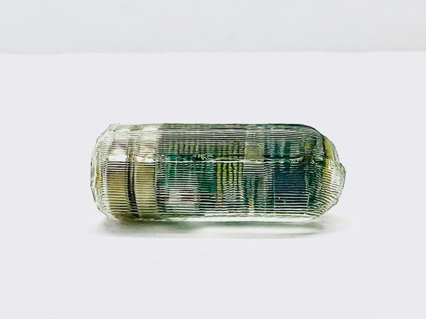 A photo of an ingestible smart pill for wireless gastrointestinal tract monitoring which vibrates to relieve constipation and includes a sensor that can be tracked in the intestines.