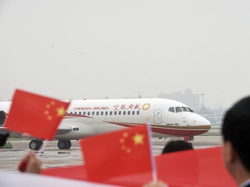 China's first domestic regional jet ARJ21-700 arrives at Shanghai Hongqiao Airport after making its first flight from Chengdu on June 28, 2016. Photo: AFP