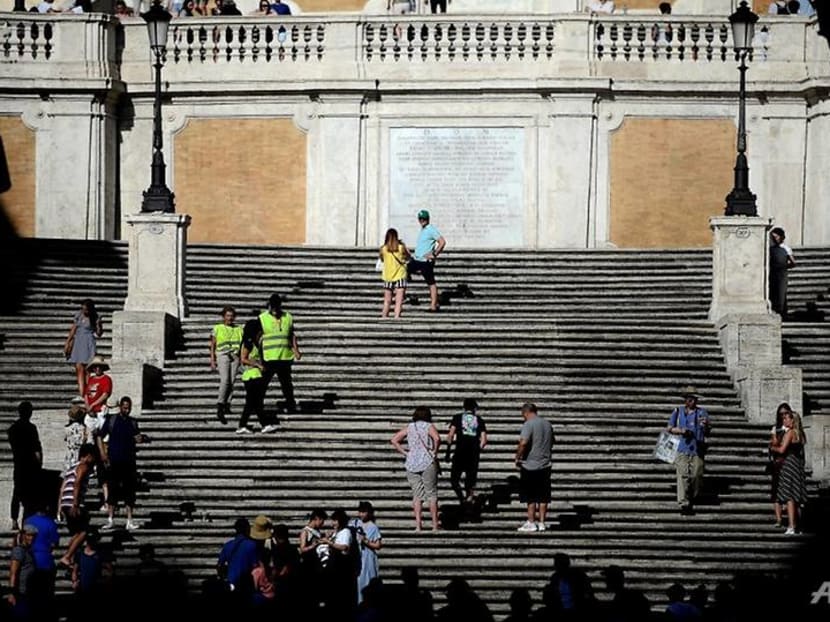 Tourists banned from sitting on Rome's Spanish Steps Tourists banned from sitting on Rome's Spanish Steps