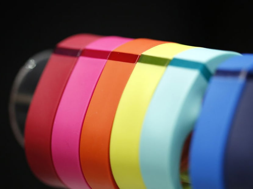 Fitbit's Fitbit Flex wireless activity and sleep wristband sit on display at the Wearable Expo in Tokyo. Photo: Bloomberg