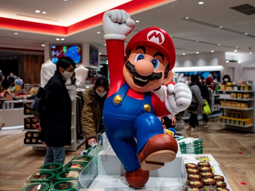 Customers shop at a Nintendo store in Tokyo on February 1, 2021.