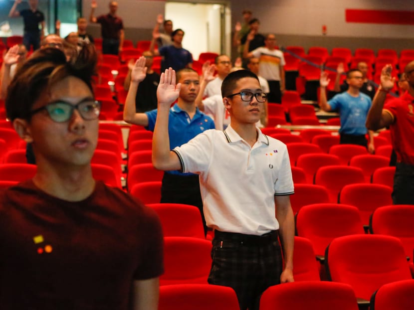Basic Military Training enlistees observing safe distancing during an oath-taking ceremony at the Pulau Tekong Auditorium on April 1, 2020.