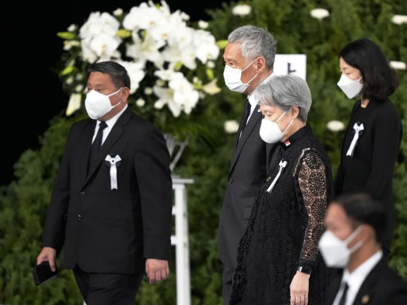 Prime Minister Lee Hsien Loong and his wife Ho Ching (centre) at the state funeral of former Japanese premier Shinzo Abe in Tokyo on Sept 27, 2022.  