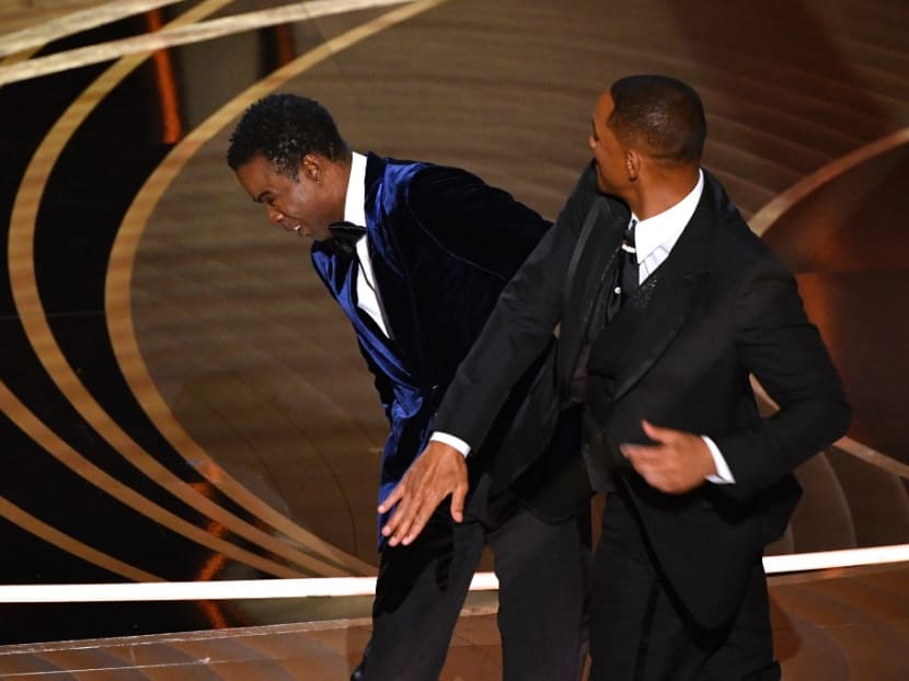 Actor Will Smith slaps comedian Chris Rock onstage during the 94th Oscars at the Dolby Theatre in Hollywood, California on March 27, 2022.
